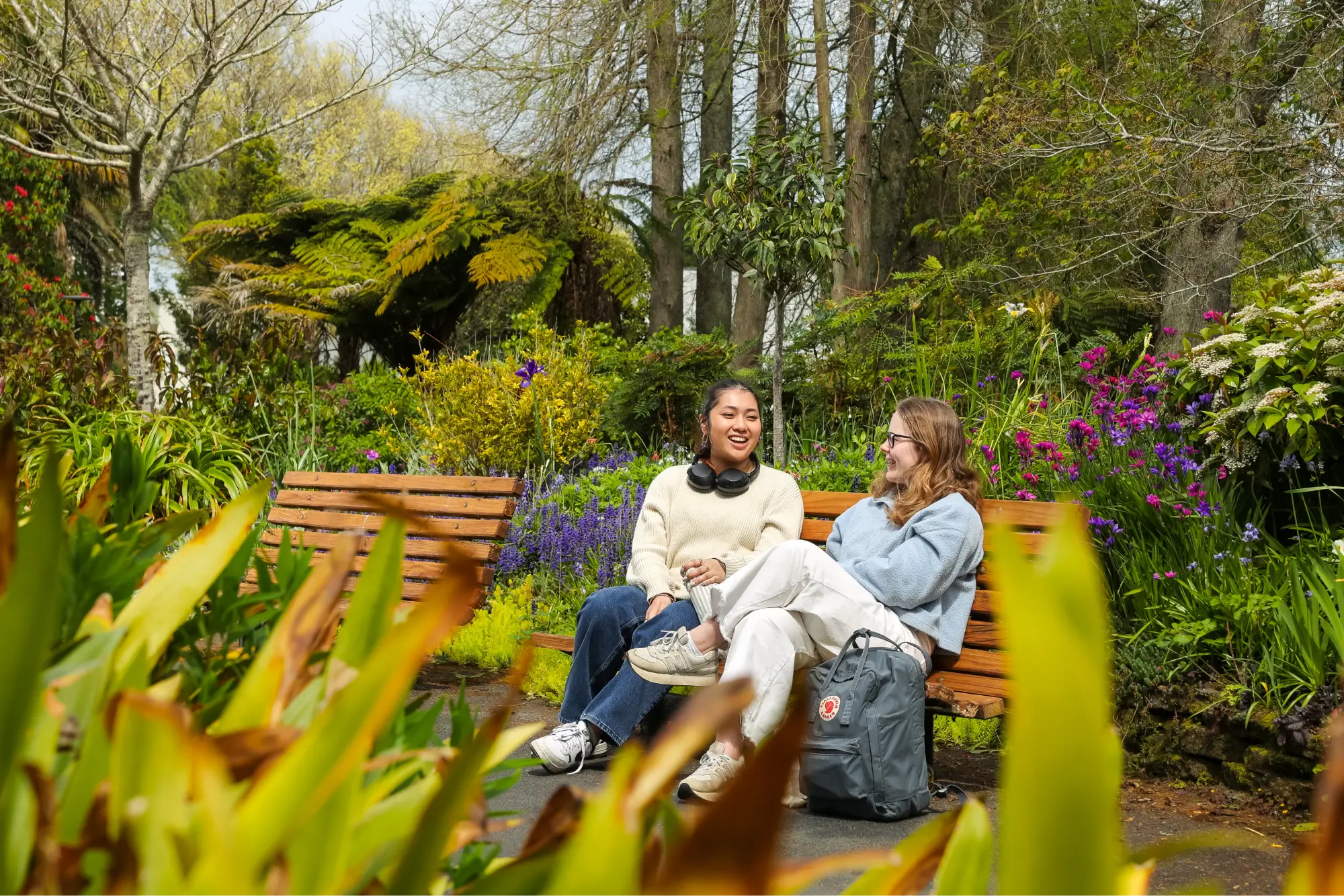 two-students-sitting-in-garden