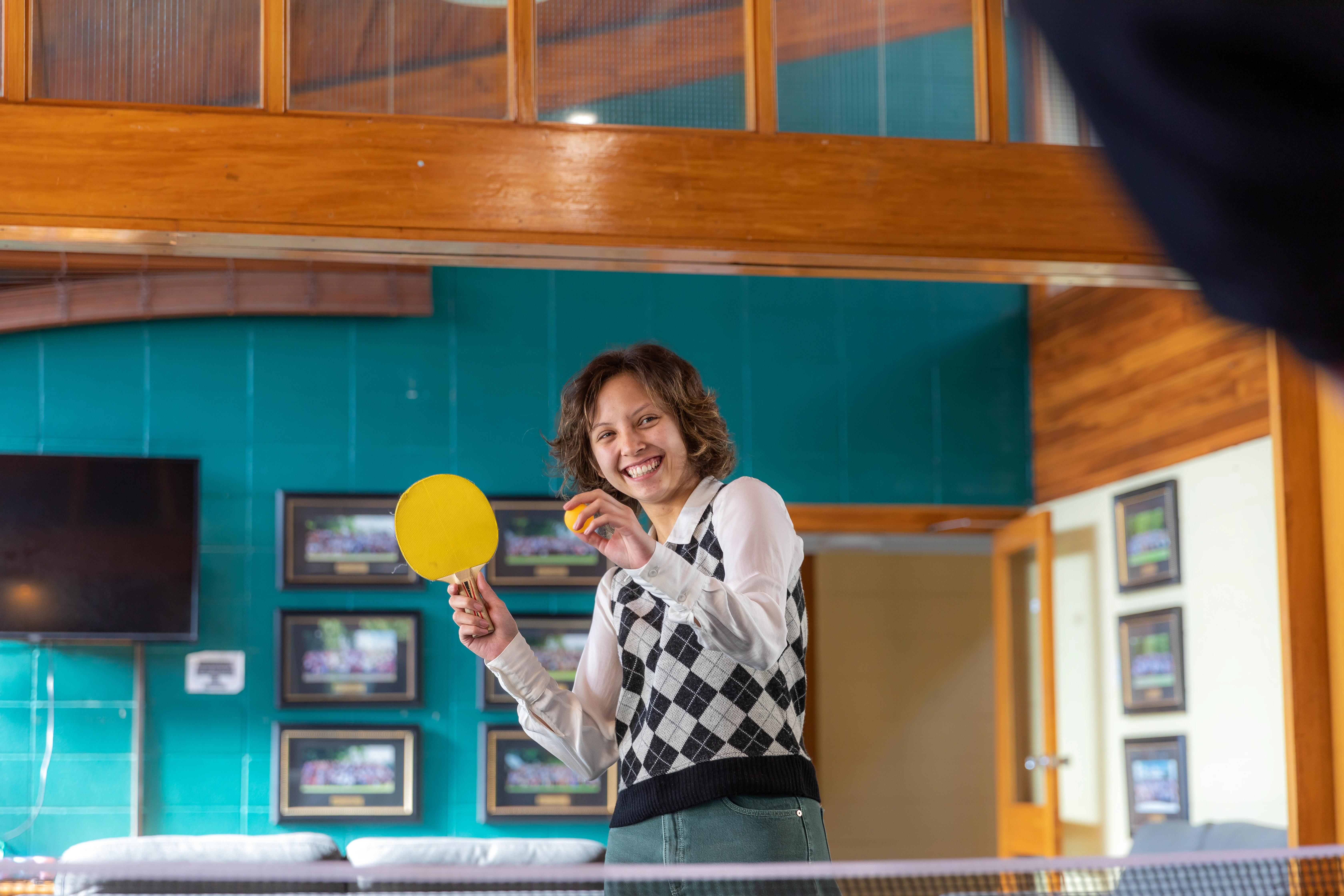 student-hitting-ping-pong-ball