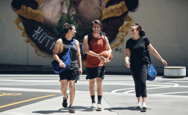 People on a basketball field. 